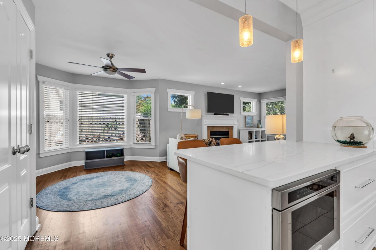Fireplace, Interior, Kitchen, Pendant Lights, Recessed Lighting, Wood Texture Flooring