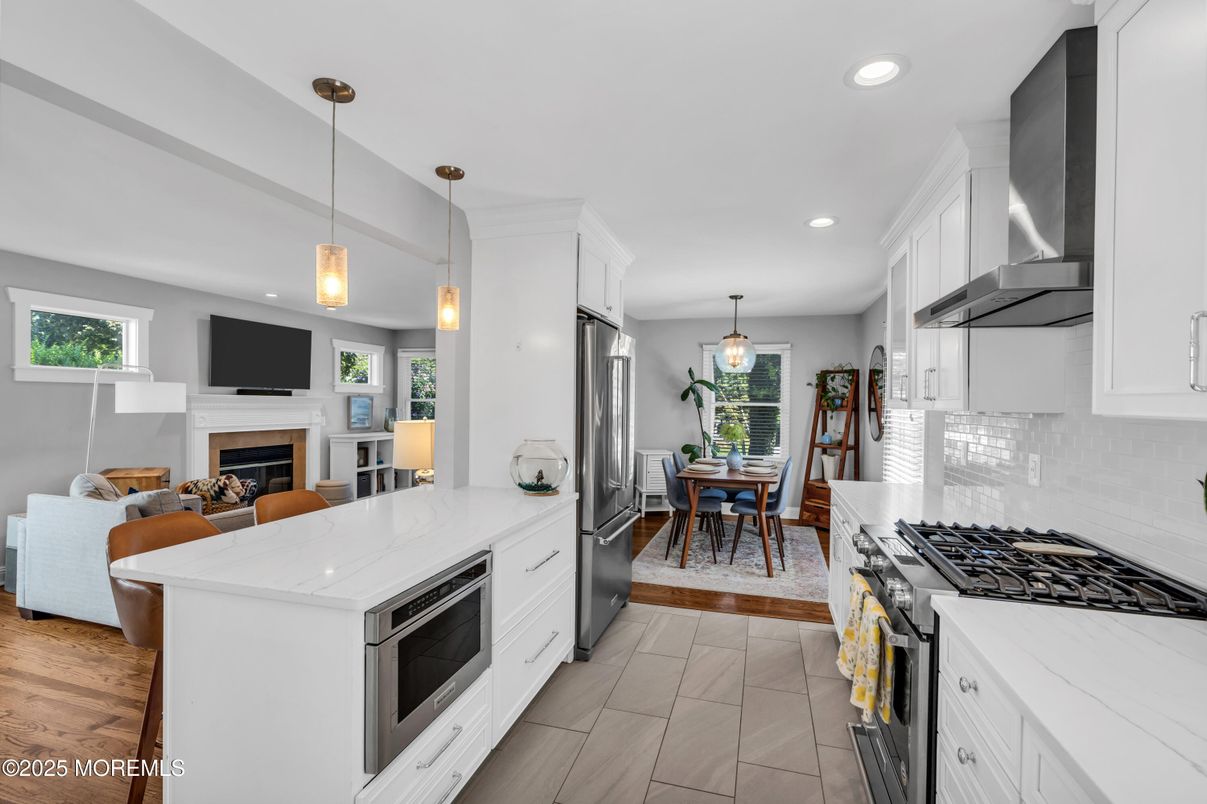 Dining room, Fireplace, Interior, Kitchen, Living room, Pendant Lights, Recessed Lighting, Stainless Steel Appliances