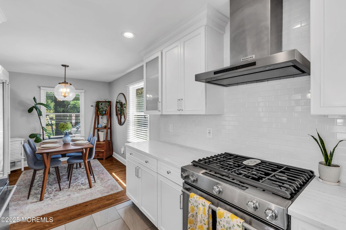 Dining room, Interior, Kitchen, Pendant Lights, Recessed Lighting, Stainless Steel Appliances, Wood Texture Flooring