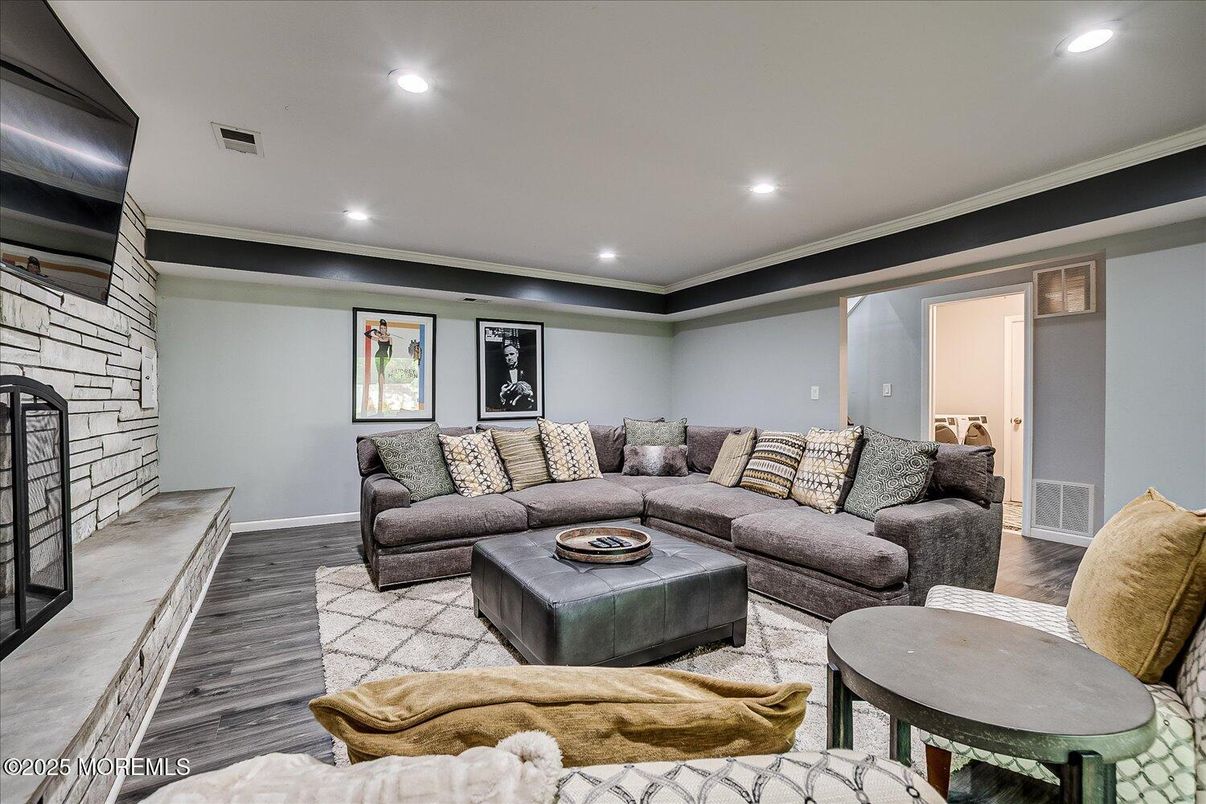 Fireplace, Interior, Living room, Recessed Lighting, Stone Walls, Wood Texture Flooring