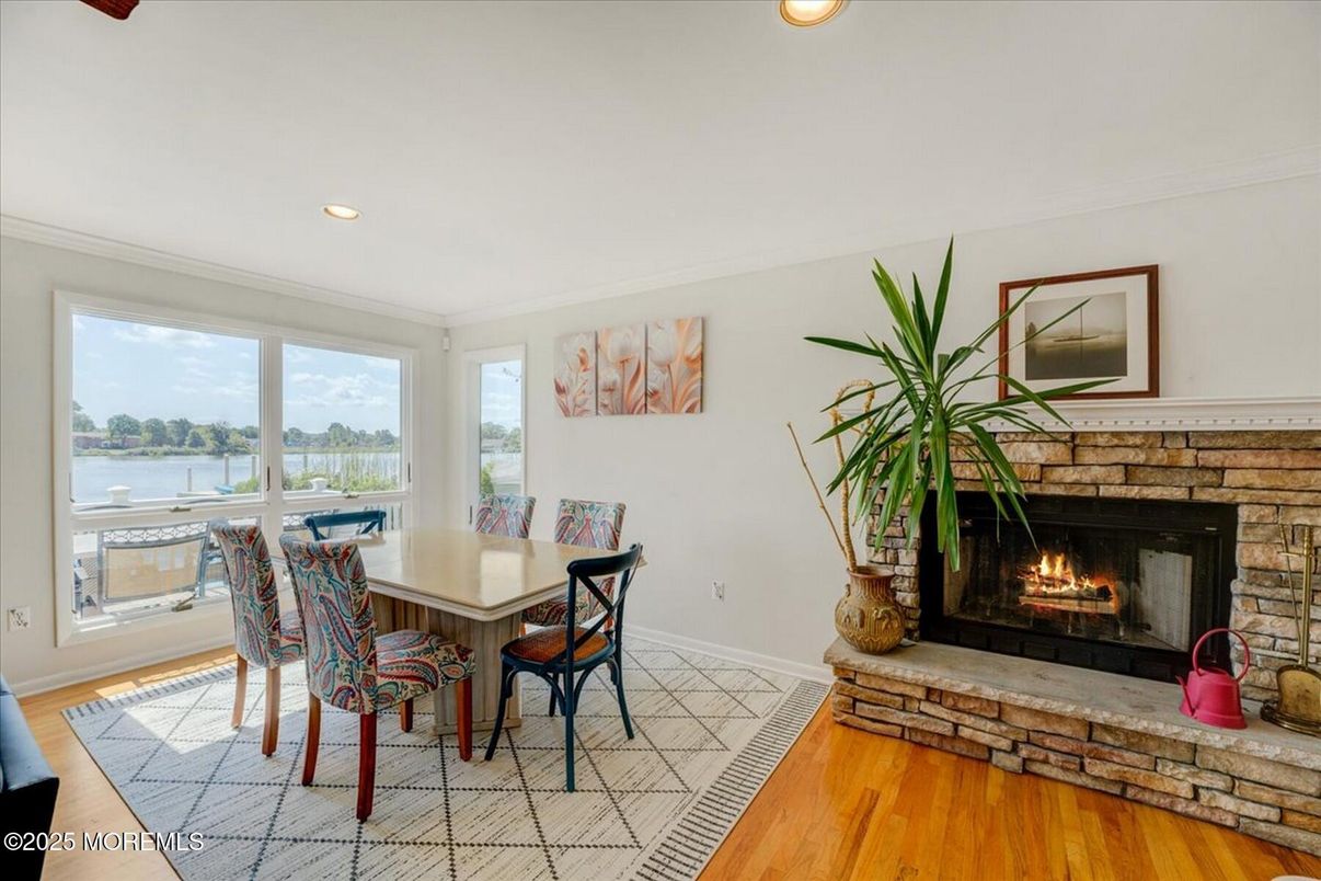 Dining room, Fireplace, Interior, Recessed Lighting, Water, Wood Texture Flooring