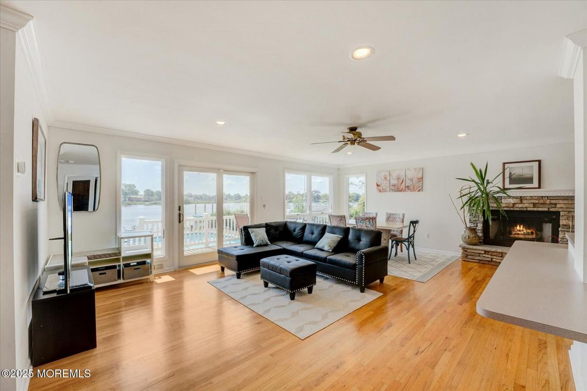 Dining room, Fireplace, Interior, Living room, Recessed Lighting, Wood Texture Flooring