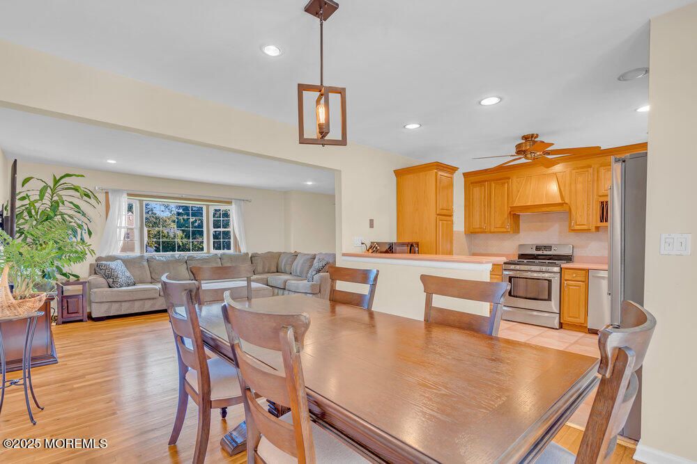 Dining room, Interior, Kitchen, Living room, Pendant Lights, Recessed Lighting, Stainless Steel Appliances, Wood Texture Flooring