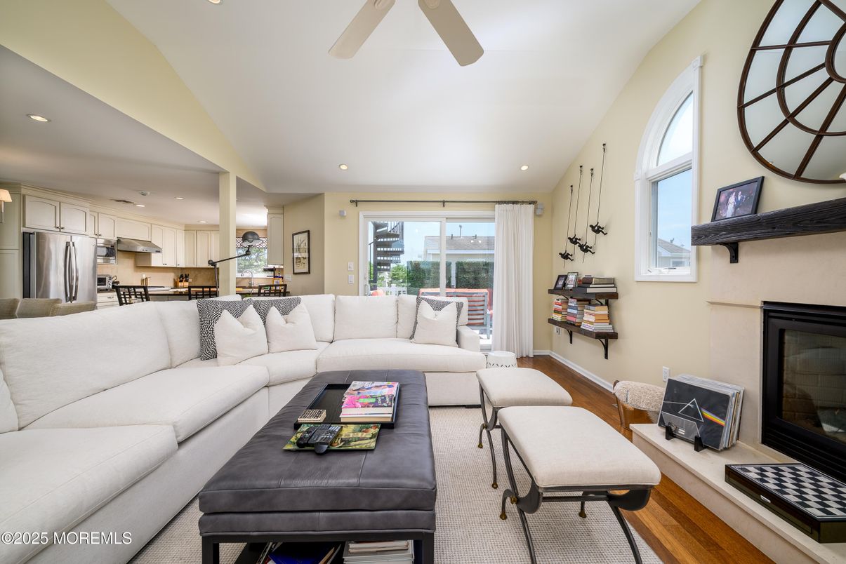Fireplace, Interior, Kitchen, Living room, Recessed Lighting, Stainless Steel Appliances, Wood Texture Flooring