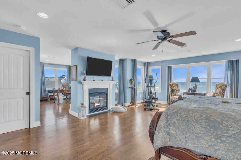 Bedroom, Fireplace, Interior, Recessed Lighting, Water, Wood Texture Flooring