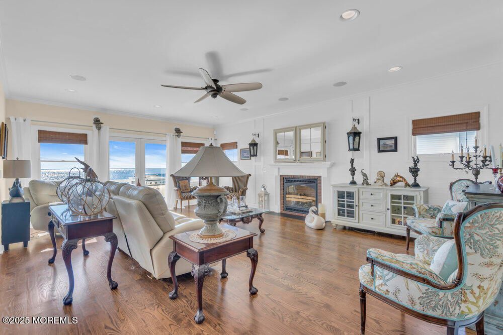 Fireplace, Interior, Living room, Recessed Lighting, Water, Wood Texture Flooring