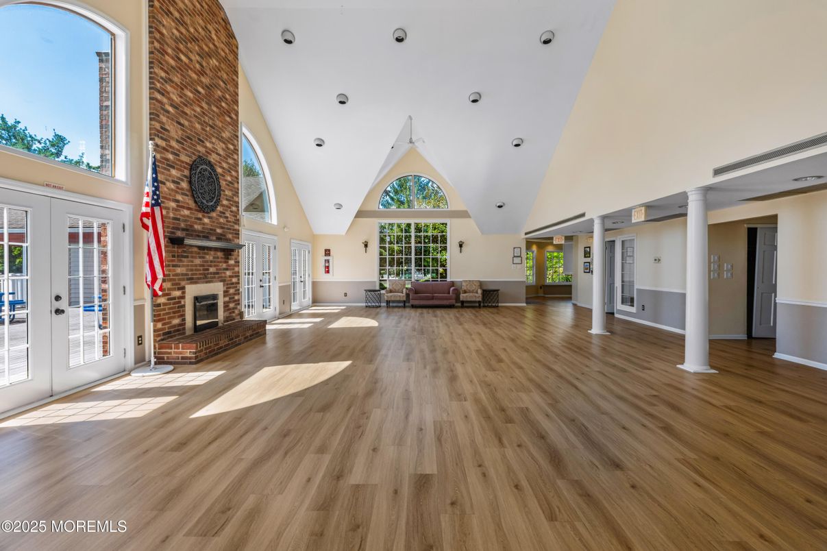 Empty room, Fireplace, Interior, Recessed Lighting, Stone Walls, Wood Texture Flooring
