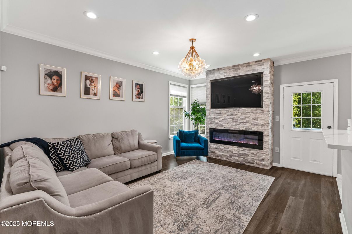 Chandelier, Fireplace, Interior, Living room, Recessed Lighting, Wood Texture Flooring