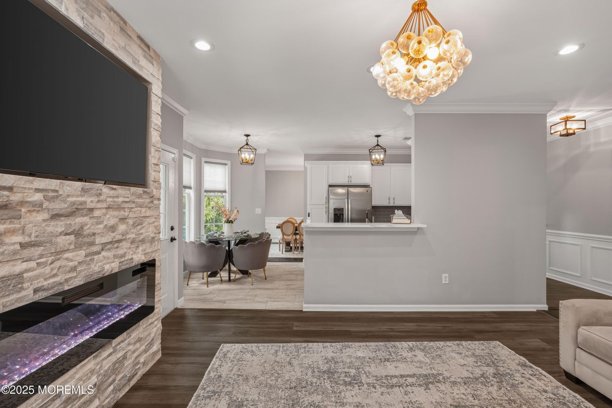Chandelier, Dining room, Interior, Kitchen, Pendant Lights, Recessed Lighting, Stainless Steel Appliances, Stone Walls, Wood Texture Flooring