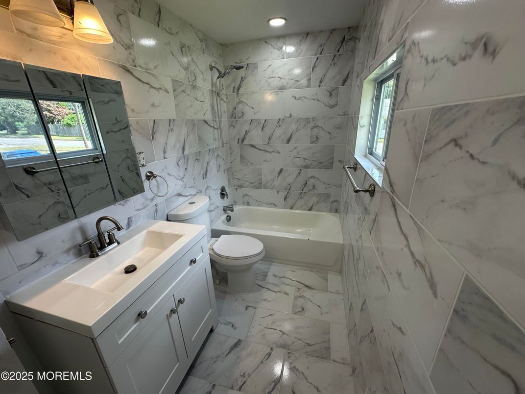 Bathroom, Dual Sink Vanities, Interior, Marble, Marble Walls, Recessed Lighting