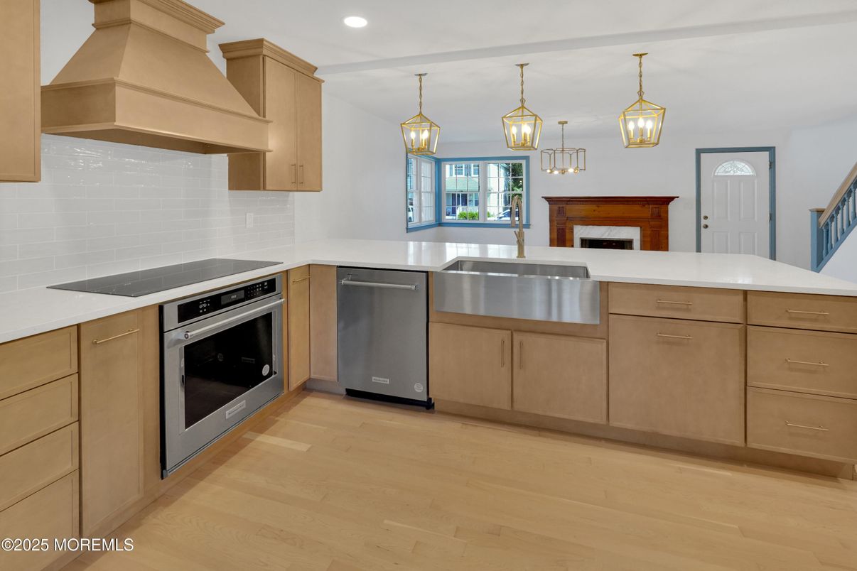 Fireplace, Interior, Kitchen, Pendant Lights, Recessed Lighting, Stainless Steel Appliances, Wood Texture Flooring