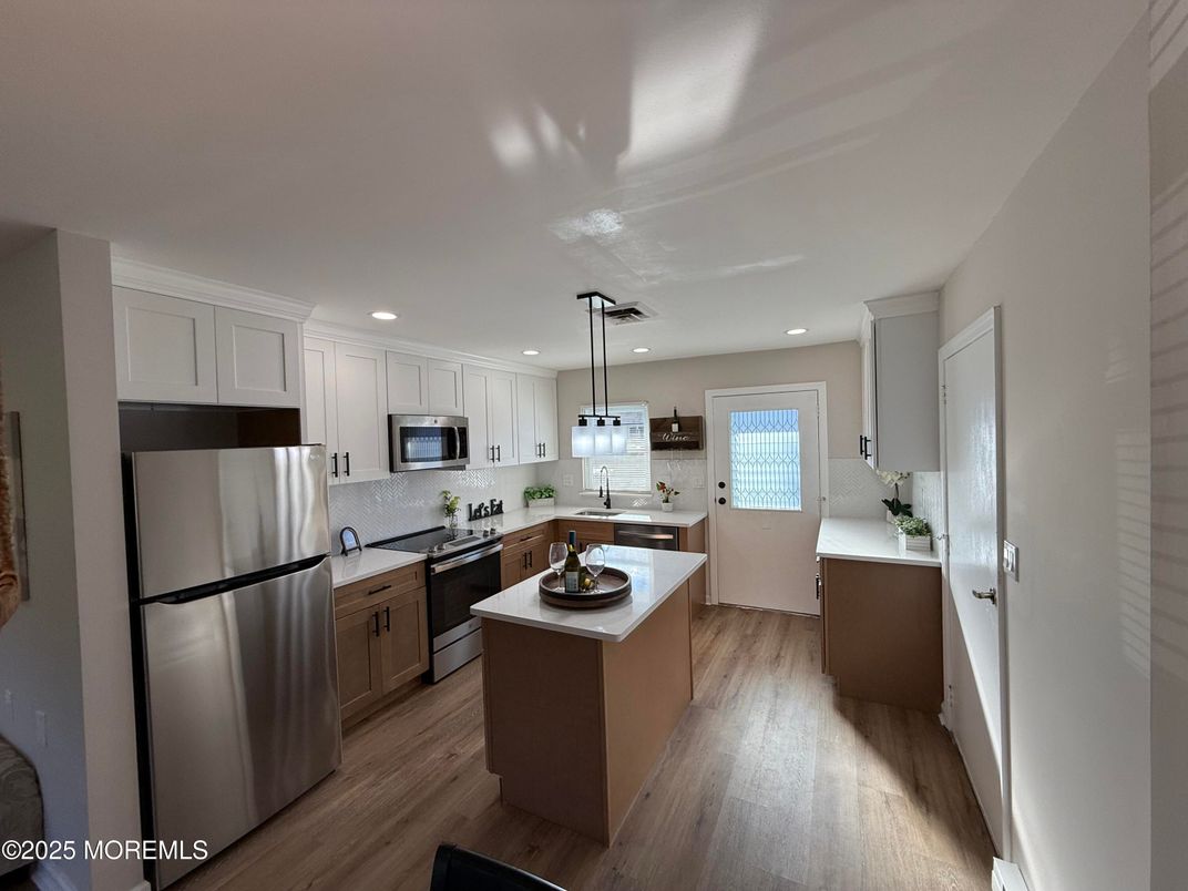 Interior, Kitchen, Pendant Lights, Recessed Lighting, Stainless Steel Appliances, Wood Texture Flooring