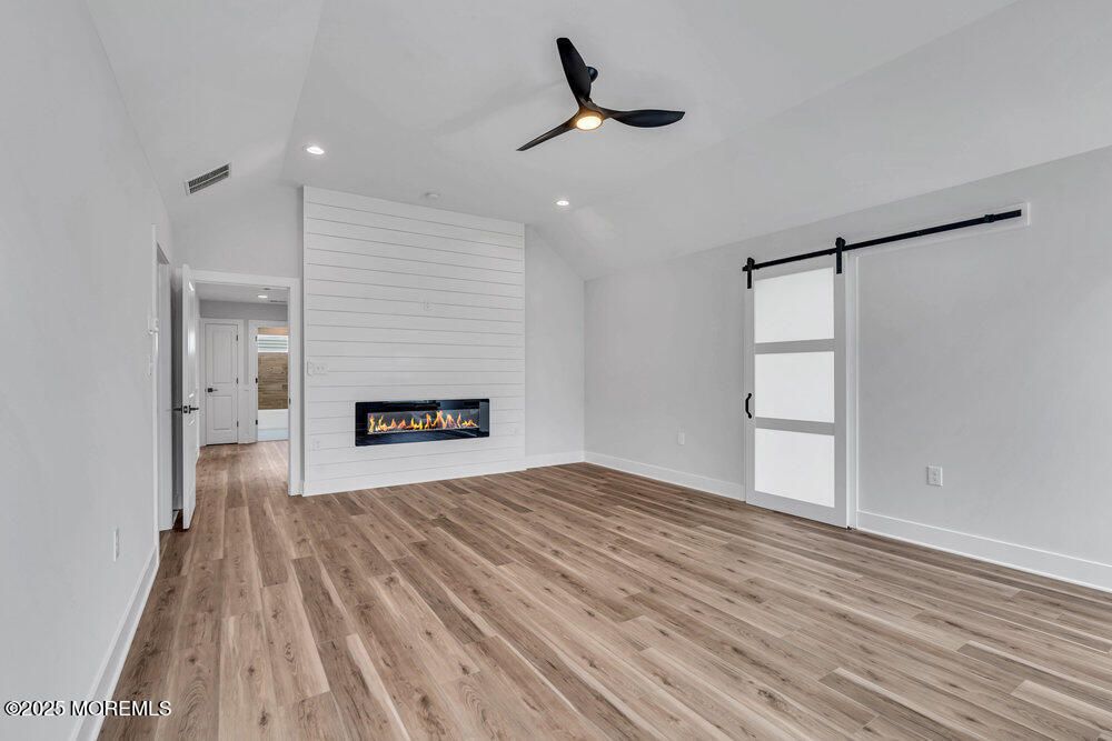 Empty room, Fireplace, Interior, Recessed Lighting, Wood Texture Flooring