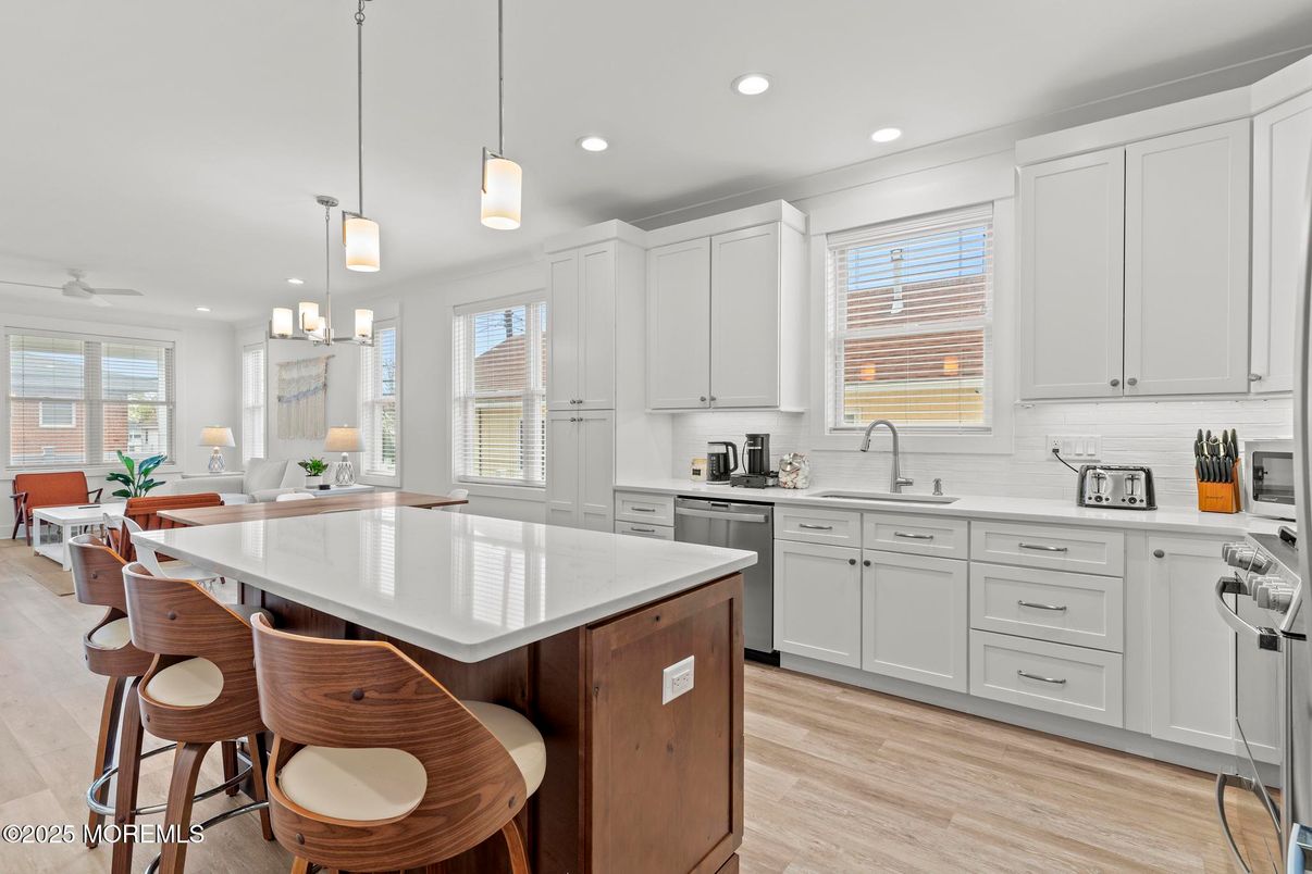 Dining room, Interior, Kitchen, Pendant Lights, Recessed Lighting, Stainless Steel Appliances, Wood Texture Flooring