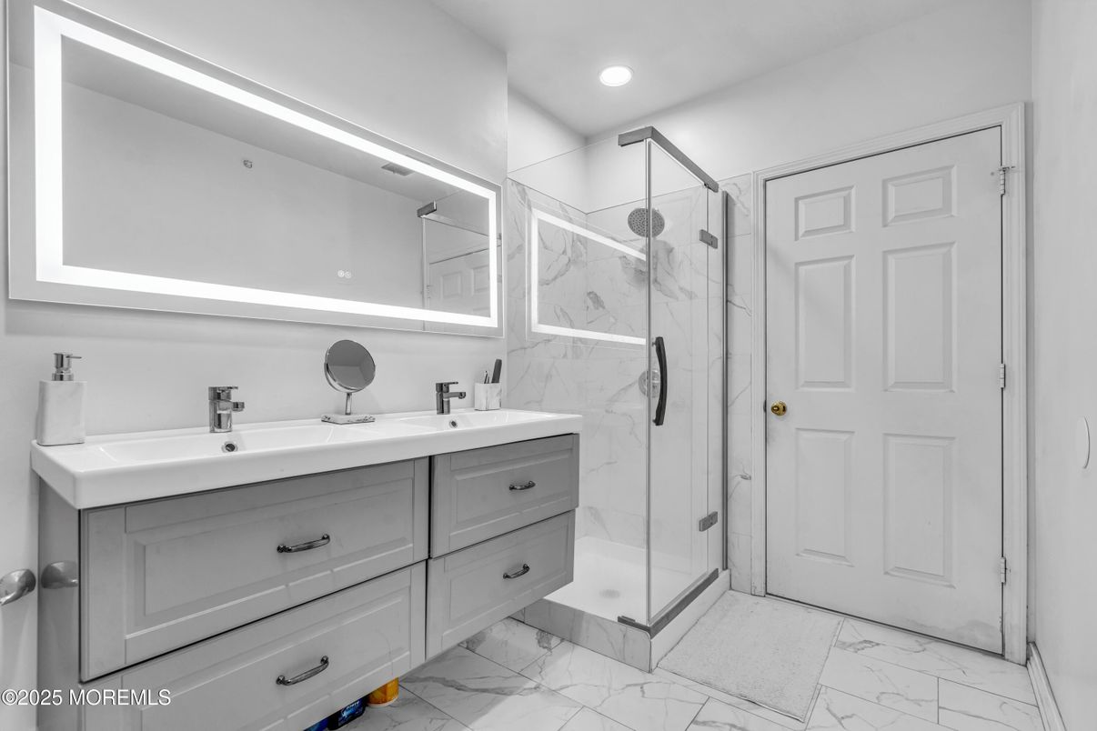 Bathroom, Dual Sink Vanities, Glass Shower, Interior, Marble, Marble Walls, Recessed Lighting