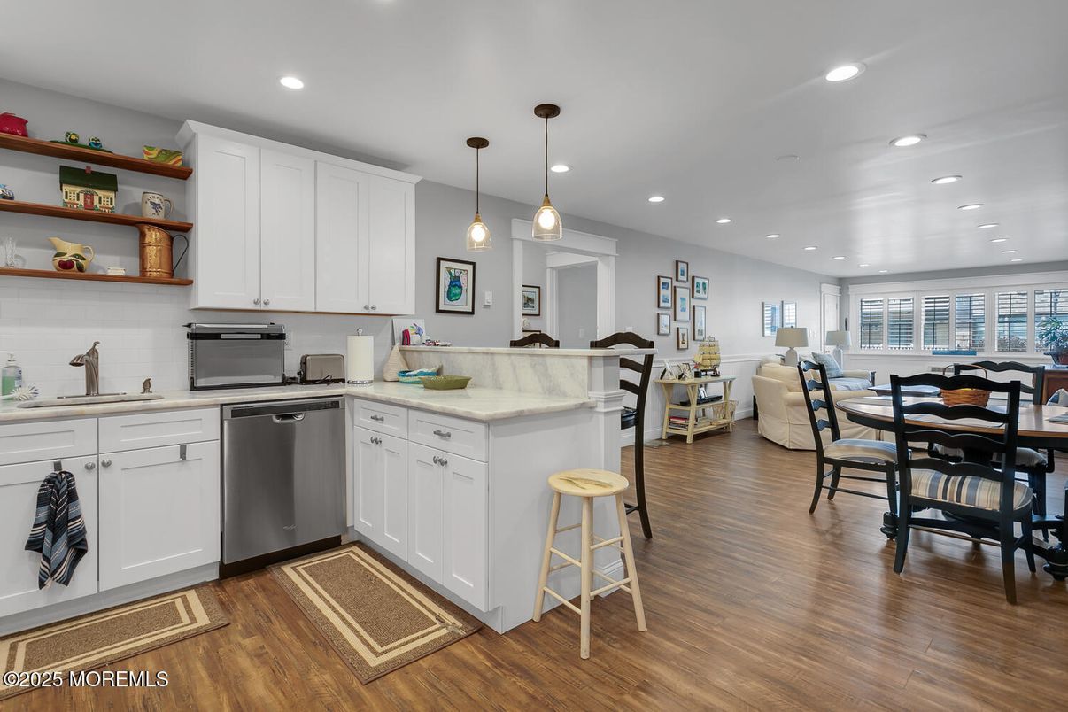Dining room, Interior, Kitchen, Pendant Lights, Recessed Lighting, Stainless Steel Appliances, Wood Texture Flooring