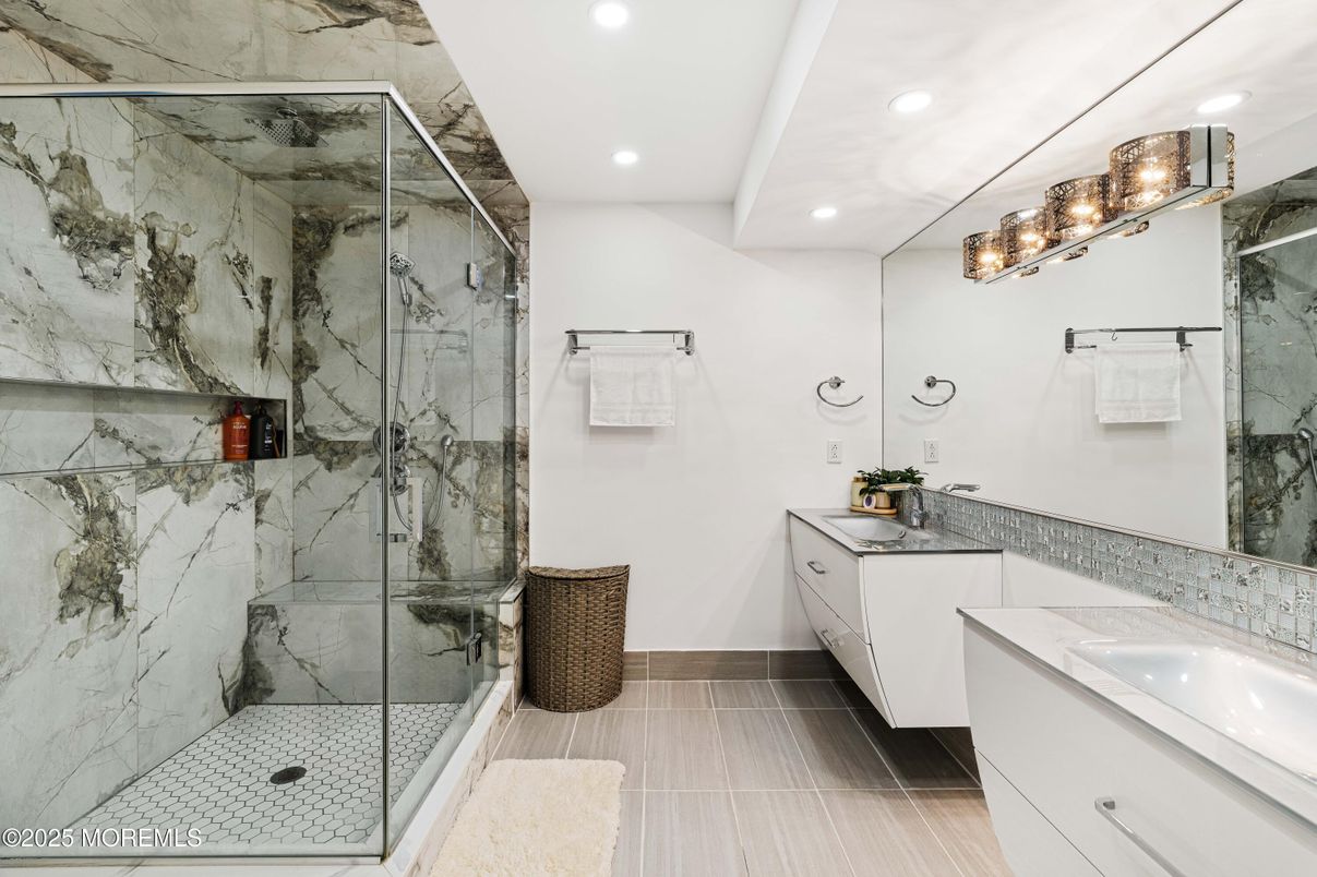 Bathroom, Dual Sink Vanities, Glass Shower, Interior, Marble Walls, Recessed Lighting