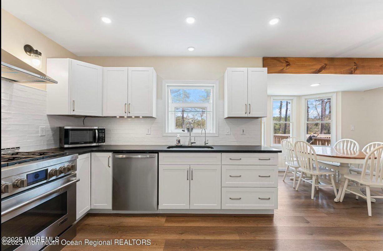 Dining room, Interior, Kitchen, Recessed Lighting, Stainless Steel Appliances, Wood Texture Flooring