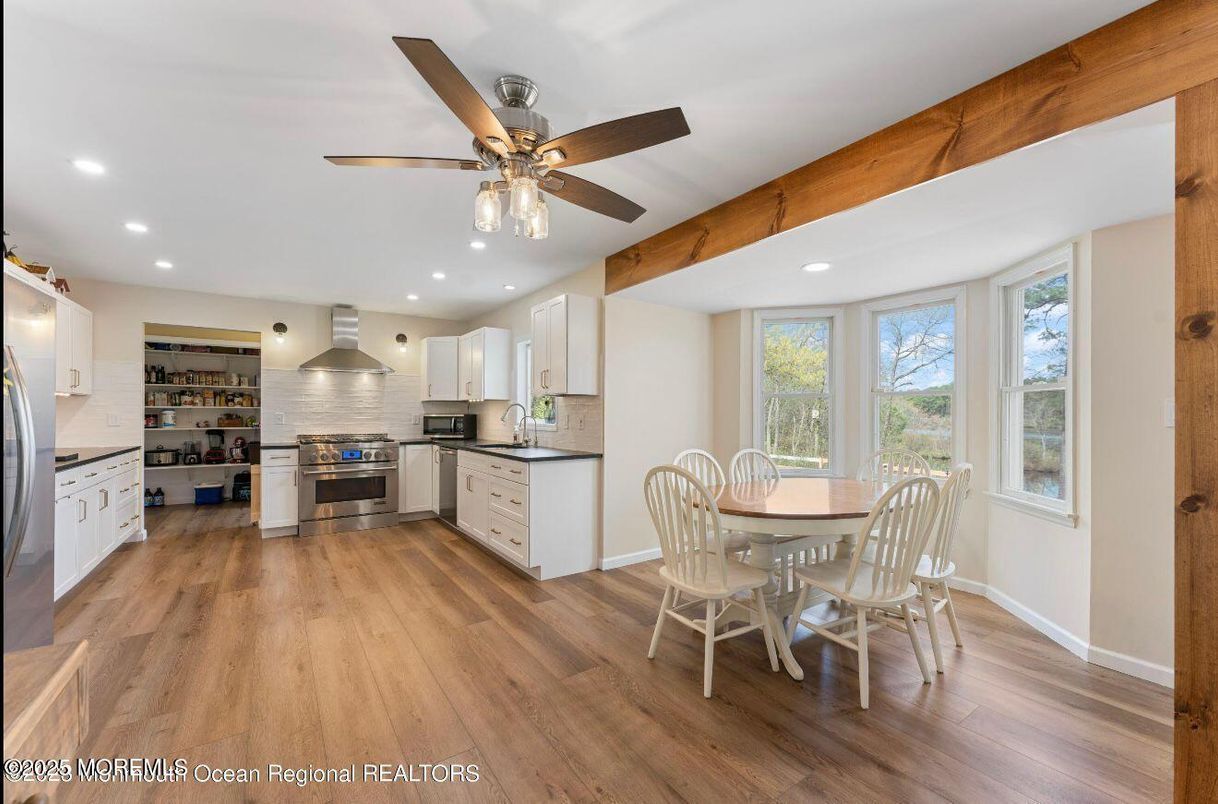 Dining room, Interior, Kitchen, Recessed Lighting, Stainless Steel Appliances, Wood Texture Flooring