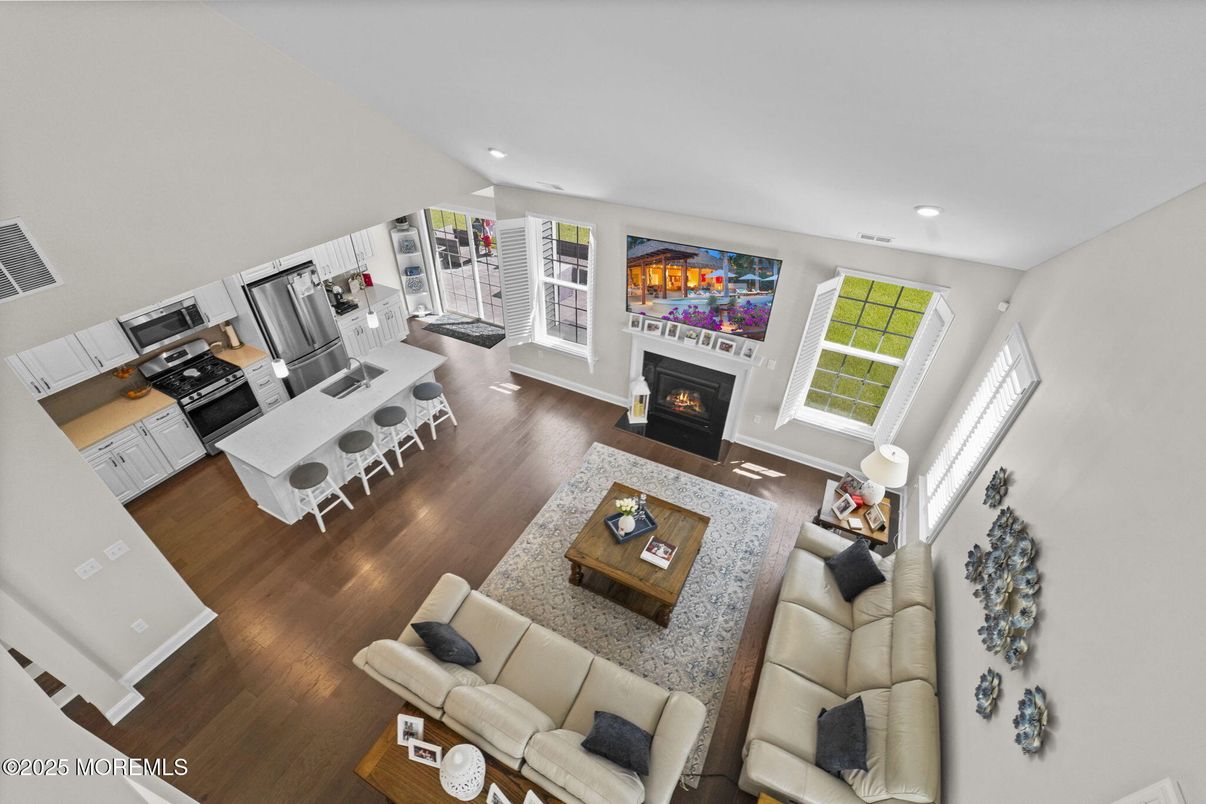 Fireplace, Interior, Kitchen, Living room, Recessed Lighting, Stainless Steel Appliances, Wood Texture Flooring