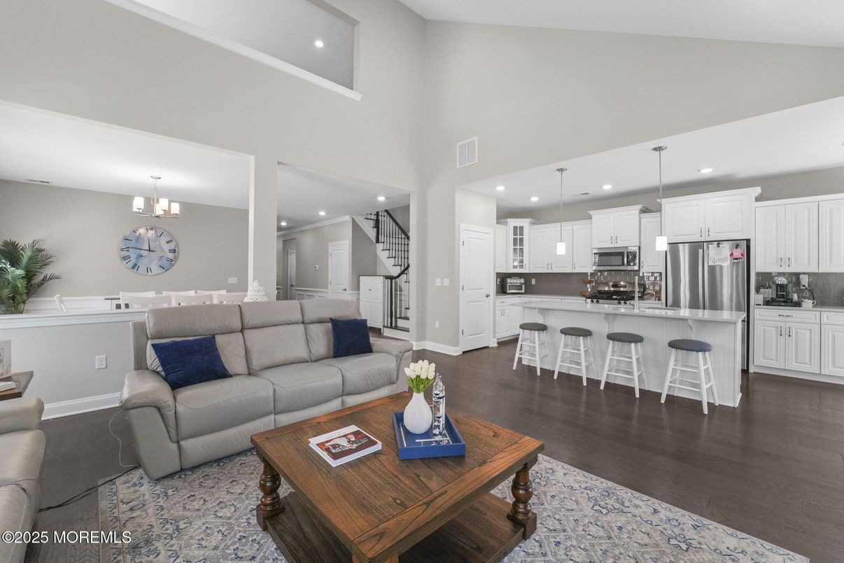 Chandelier, Dining room, Interior, Kitchen, Living room, Pendant Lights, Recessed Lighting, Stainless Steel Appliances, Wood Texture Flooring