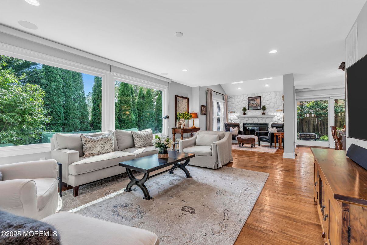 Fireplace, Interior, Living room, Recessed Lighting, Stone Walls, Wood Texture Flooring