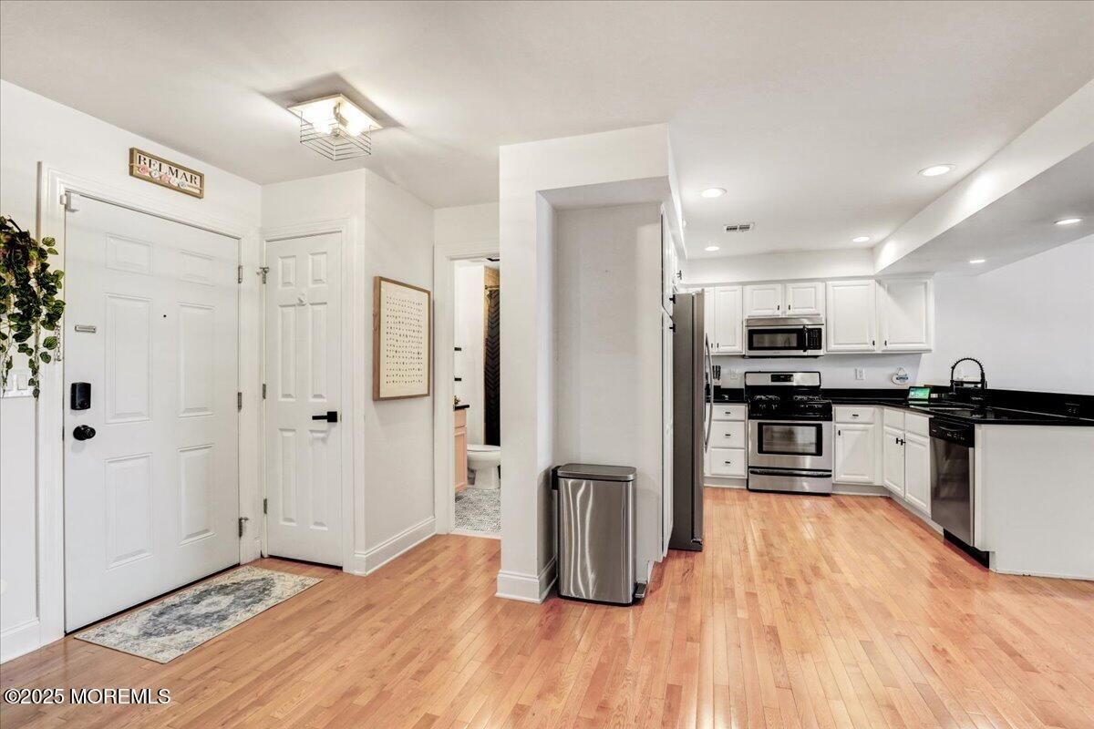 Interior, Kitchen, Recessed Lighting, Stainless Steel Appliances, Wood Texture Flooring