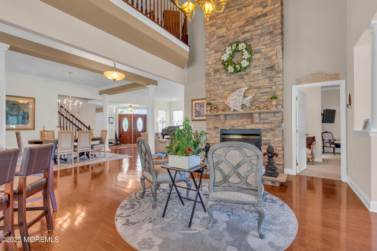 Chandelier, Dining room, Fireplace, Interior, Pendant Lights, Stone Walls, Wood Texture Flooring