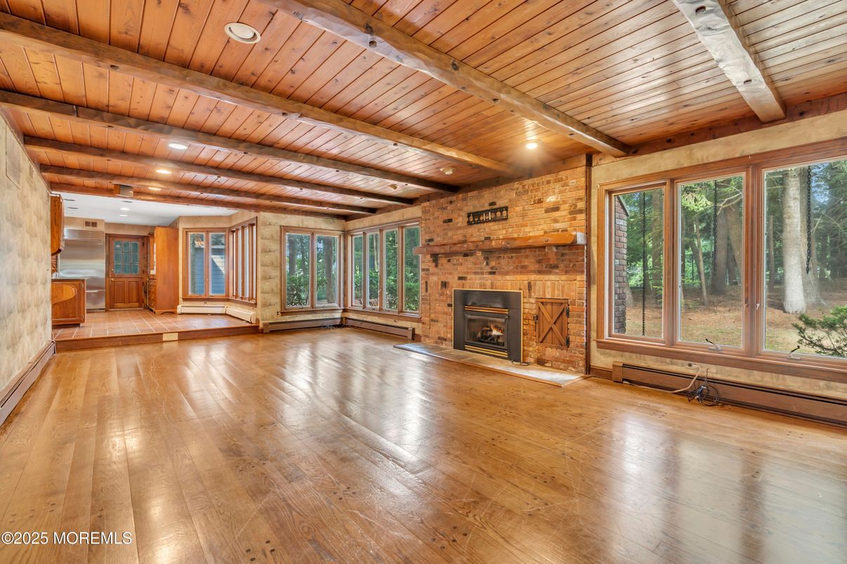 Empty room, Fireplace, Interior, Recessed Lighting, Stone Walls, Wooden Beams, Wooden Ceilings, Wood Texture Flooring