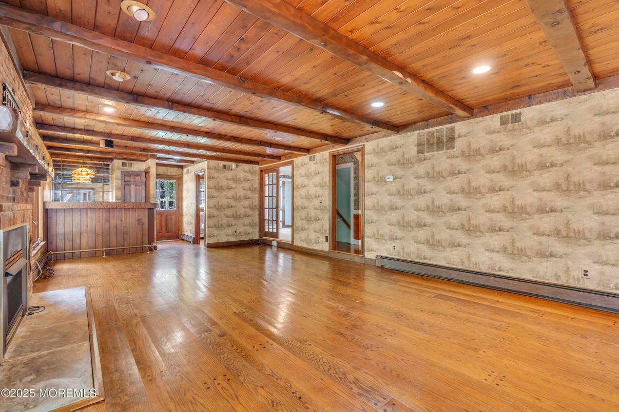 Empty room, Fireplace, Interior, Recessed Lighting, Stone Walls, Wooden Beams, Wooden Ceilings, Wood Texture Flooring