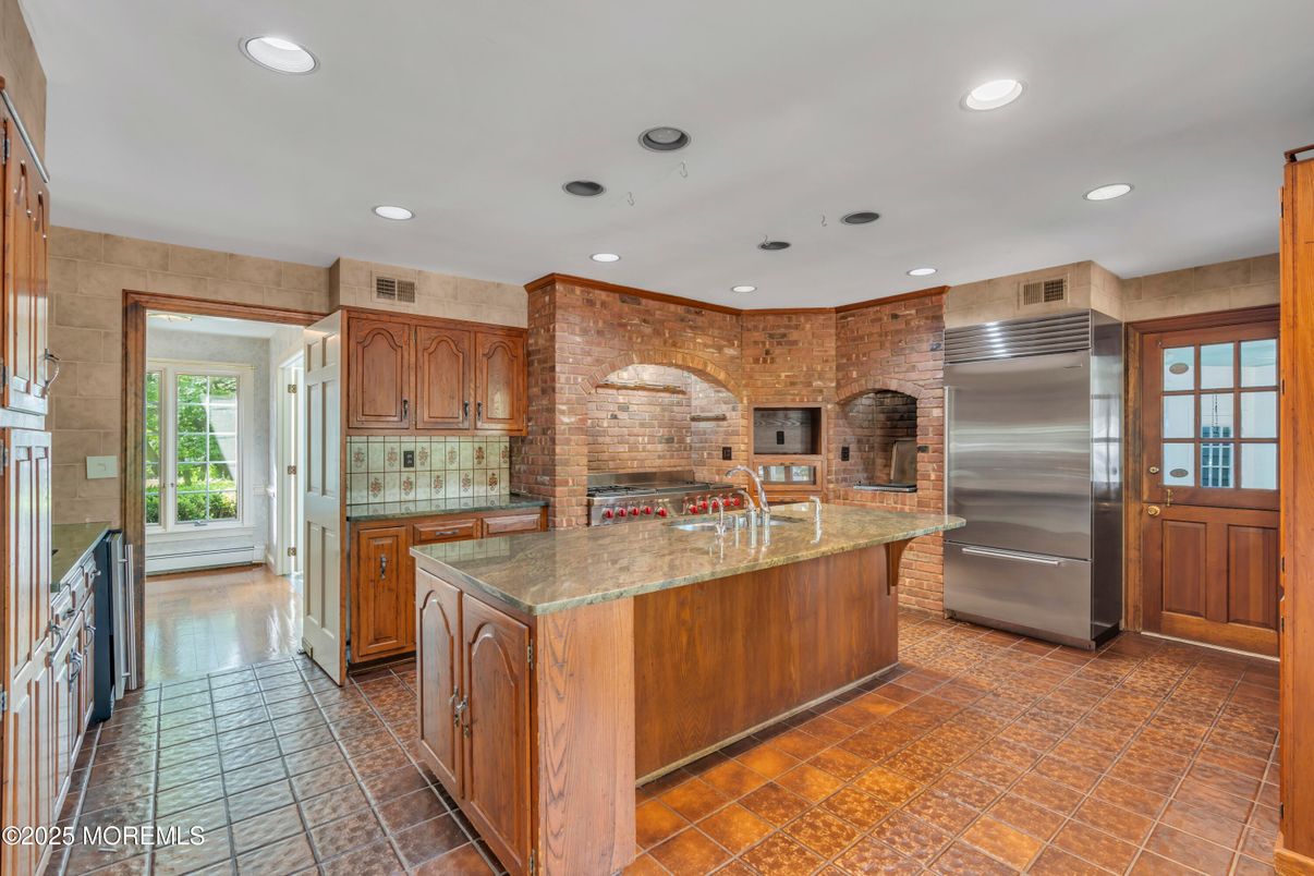 Interior, Kitchen, Recessed Lighting, Stainless Steel Appliances, Stone Walls