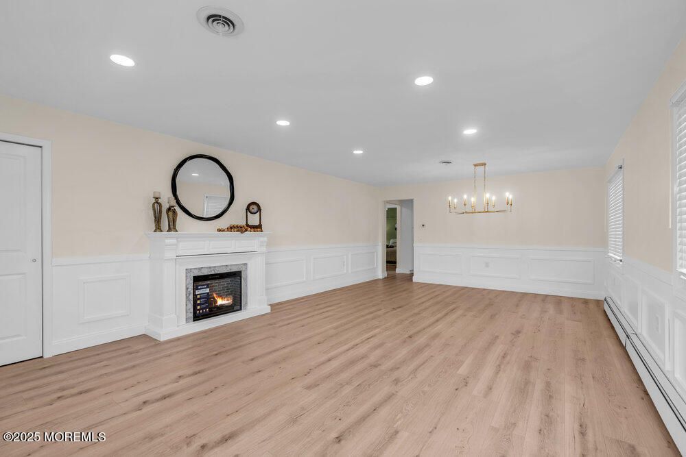 Empty room, Fireplace, Interior, Pendant Lights, Recessed Lighting, Wood Texture Flooring