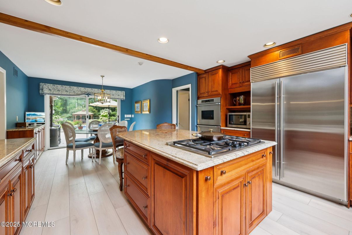 Chandelier, Dining room, Interior, Kitchen, Pendant Lights, Recessed Lighting, Stainless Steel Appliances, Wood Texture Flooring