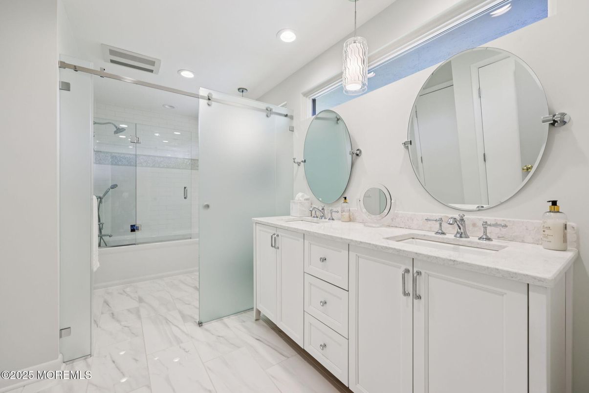 Bathroom, Dual Sink Vanities, Glass Shower, Interior, Marble, Pendant Lights, Recessed Lighting