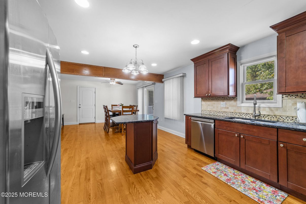 Chandelier, Dining room, Interior, Kitchen, Pendant Lights, Recessed Lighting, Stainless Steel Appliances, Wood Texture Flooring