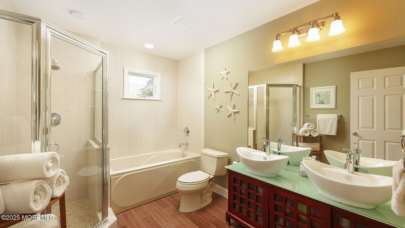 Bathroom, Dual Sink Vanities, Glass Shower, Interior, Recessed Lighting, Wood Texture Flooring