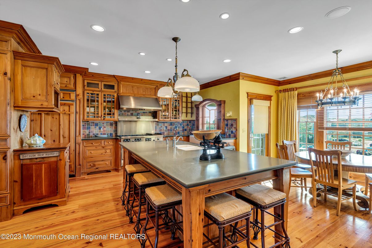 Chandelier, Dining room, Interior, Kitchen, Pendant Lights, Recessed Lighting, Stainless Steel Appliances, Wood Texture Flooring