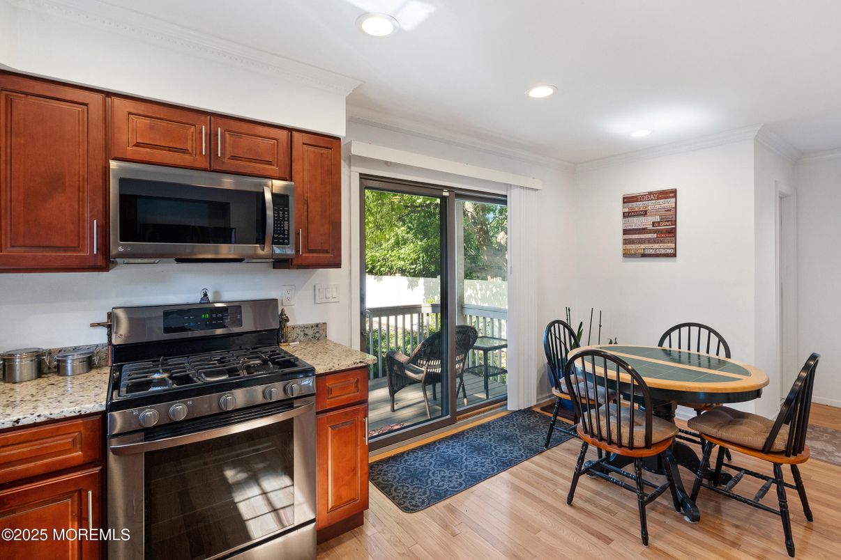 Dining room, Interior, Kitchen, Recessed Lighting, Stainless Steel Appliances, Wood Texture Flooring