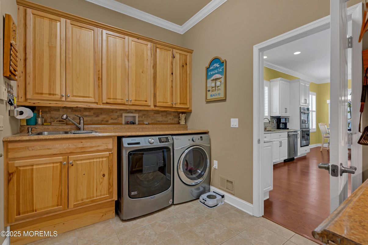 Interior, Kitchen, Recessed Lighting, Washer, Wood Texture Flooring
