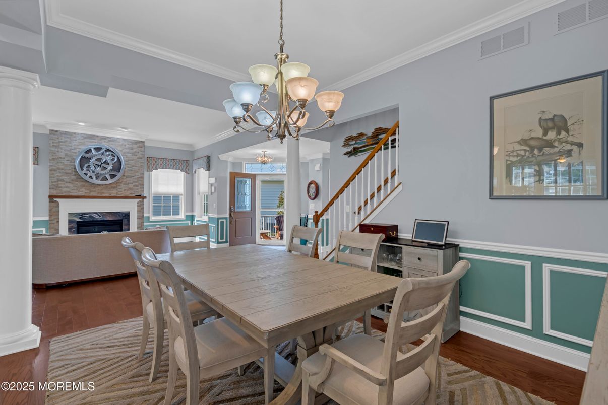 Chandelier, Dining room, Fireplace, Interior, Living room, Stone Walls, Wood Texture Flooring