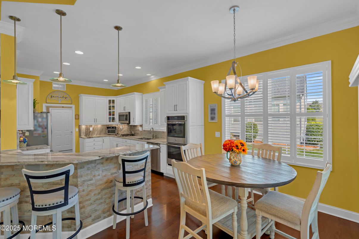 Chandelier, Dining room, Interior, Kitchen, Pendant Lights, Recessed Lighting, Stainless Steel Appliances, Wood Texture Flooring