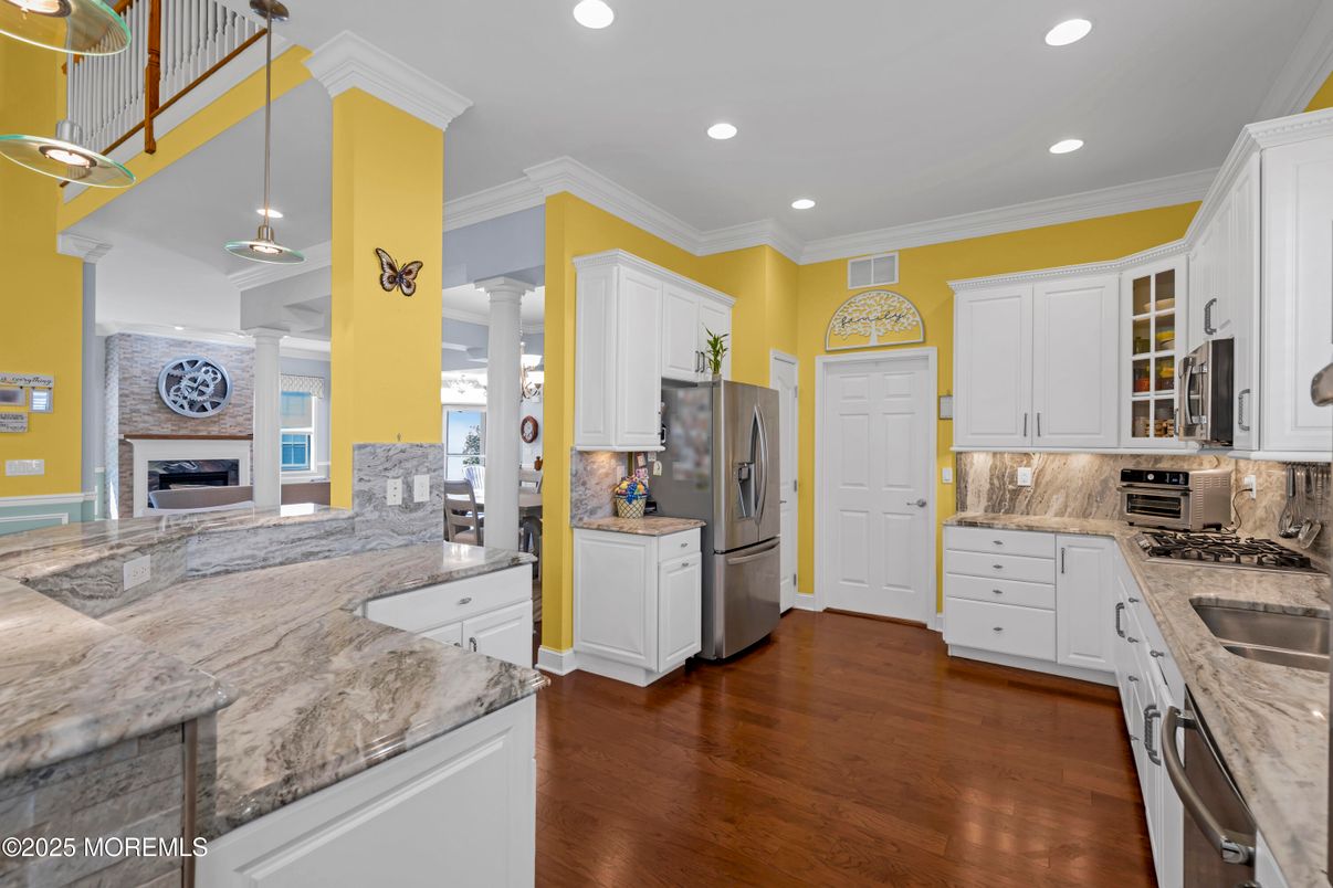 Fireplace, Interior, Kitchen, Pendant Lights, Recessed Lighting, Stainless Steel Appliances, Wood Texture Flooring