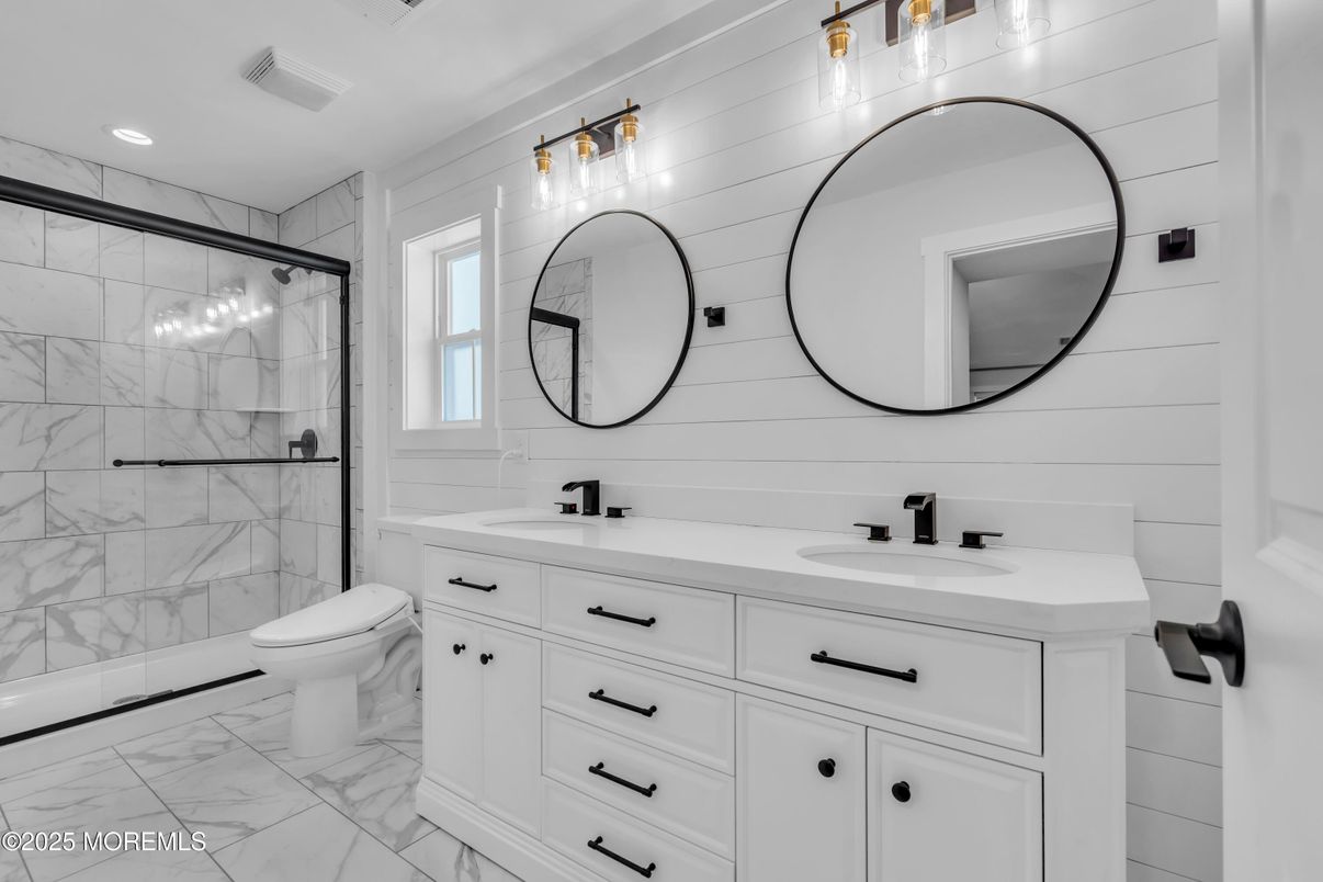 Bathroom, Dual Sink Vanities, Glass Shower, Interior, Marble, Marble Walls, Recessed Lighting