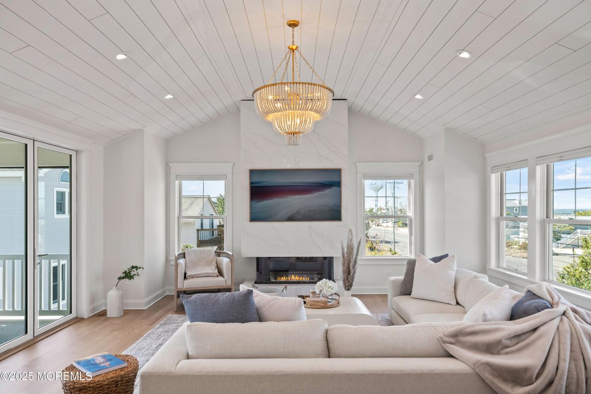 Chandelier, Fireplace, Interior, Living room, Recessed Lighting, Wood Texture Flooring
