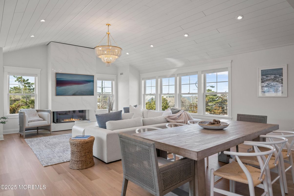 Chandelier, Dining room, Fireplace, Interior, Living room, Recessed Lighting, Wood Texture Flooring