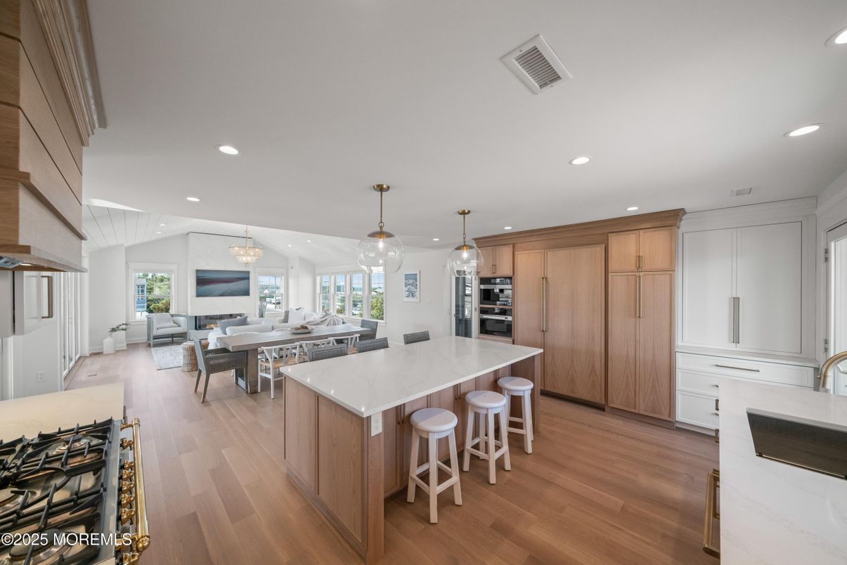 Dining room, Interior, Kitchen, Pendant Lights, Recessed Lighting, Stainless Steel Appliances, Wood Texture Flooring