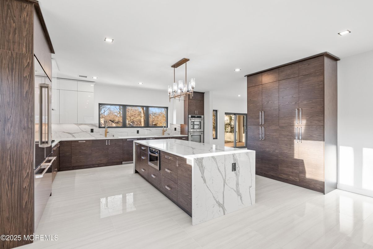 Interior, Kitchen, Marble Walls, Pendant Lights, Recessed Lighting, Stainless Steel Appliances