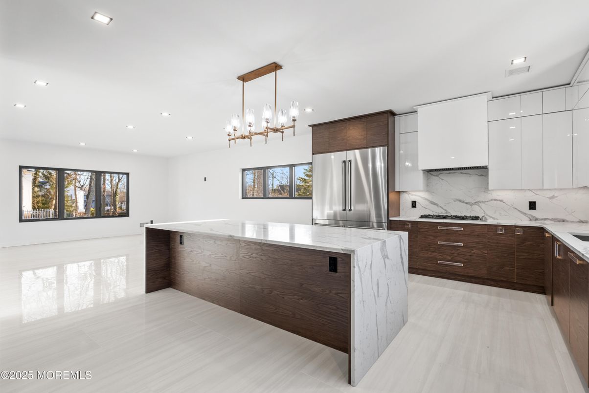Interior, Kitchen, Marble Walls, Pendant Lights, Recessed Lighting, Stainless Steel Appliances