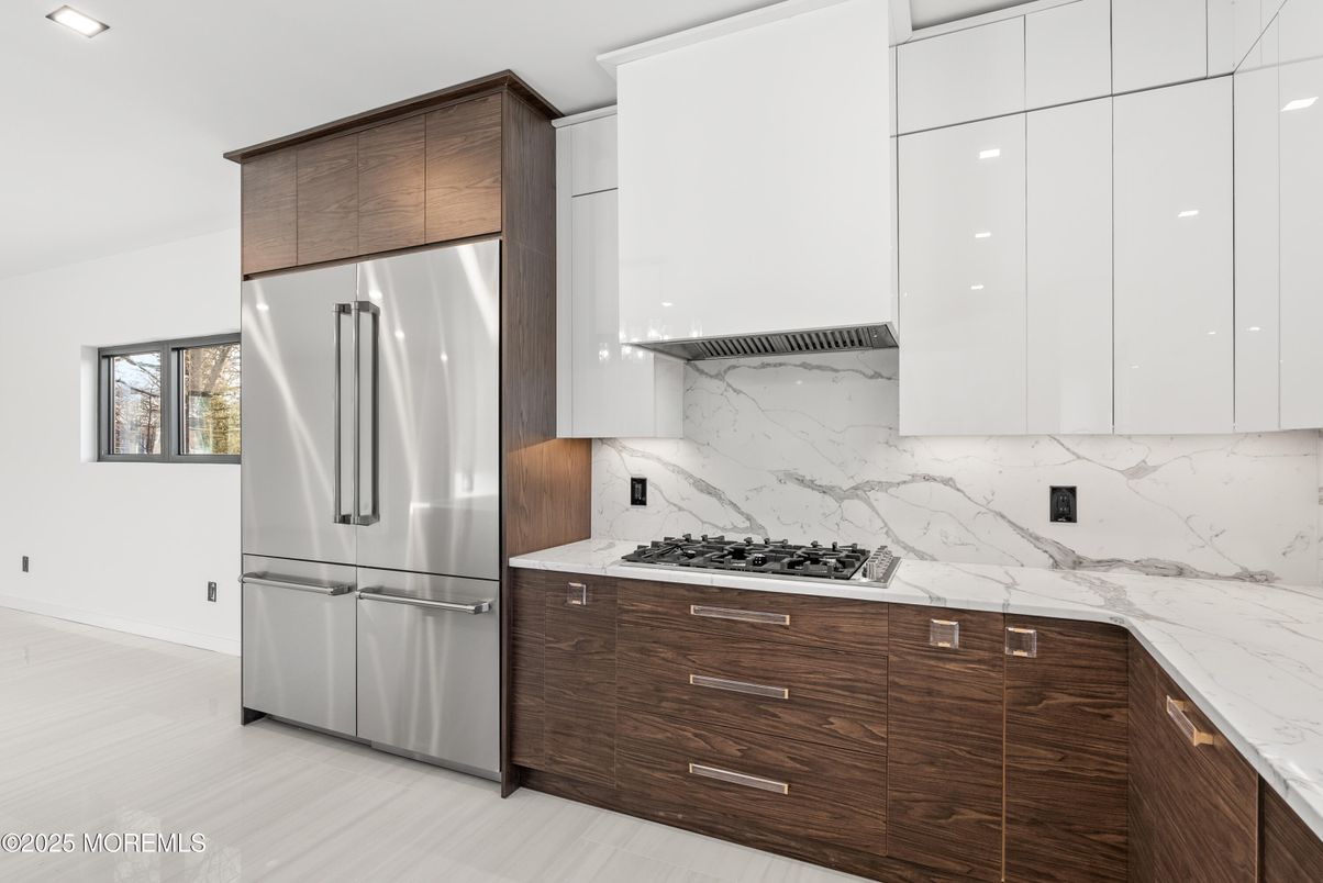 Interior, Kitchen, Marble Walls, Recessed Lighting, Stainless Steel Appliances