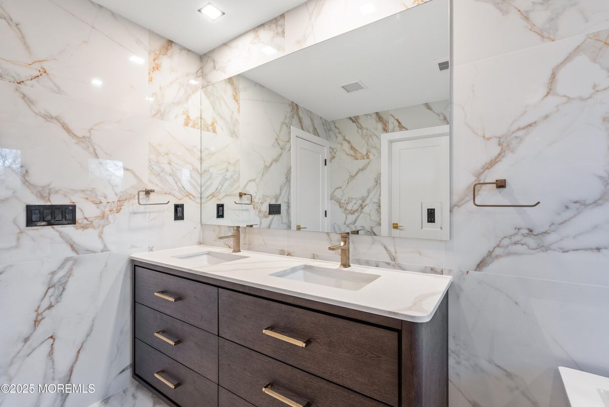Bathroom, Dual Sink Vanities, Interior, Marble Walls, Recessed Lighting